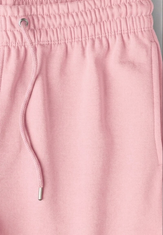 Close-up of baby pink pants with a drawstring
