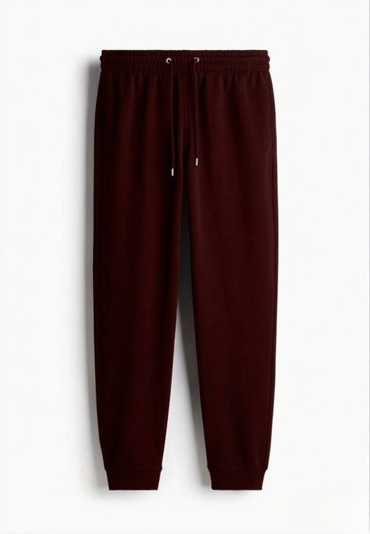 Maroon joggers on a white background