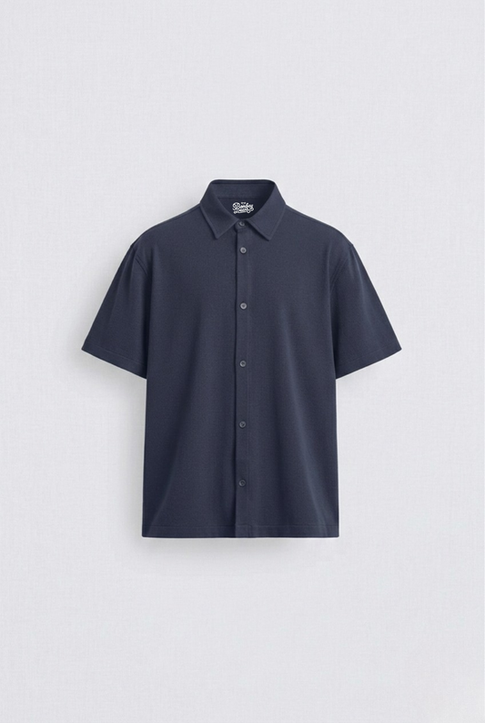 Navy Blue shirt against a light gray background
